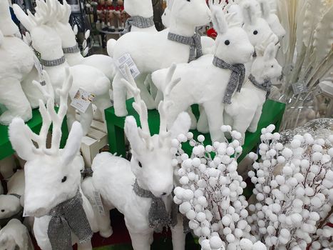 typical objects for the Christmas holidays reindeer in soft white fabric