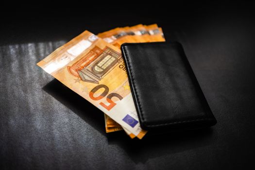 Man wallet with money on the table, wallet with EURO