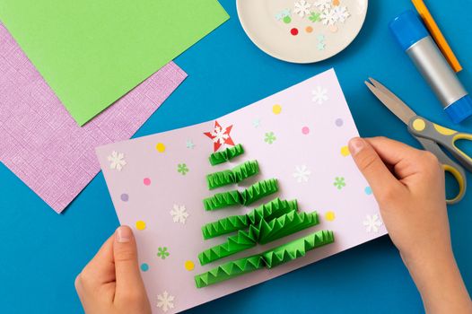 How to make Christmas card with volumetric tree. Original project for children. DIY concept. Step-by-step photo instructions. Step 9. Decorate card with confetti and snowflakes 