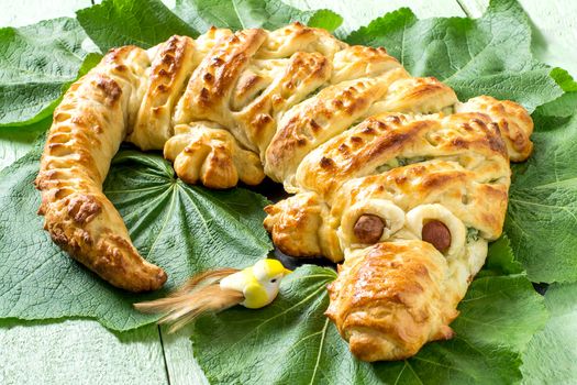 Original cake in form of crocodile with potatoes, cheese and herbs. Cake is served to Halloween party as fun and spooky monster