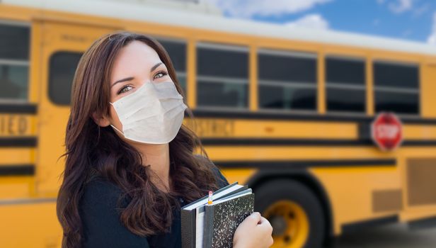 Female Student Near School Bus Wearing Medical Face Masks During Coronavirus Pandemic.