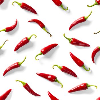 Red hot chilli seamless peppers pattern. Seamless pattern made of red chili or chilli on white background. Minimal food pattern. Food background.