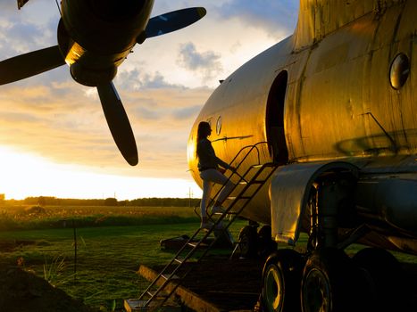 old Soviet military airplane, sunset time. Abandoned Historic Aircraft. Close up of propeller engine. Copy space