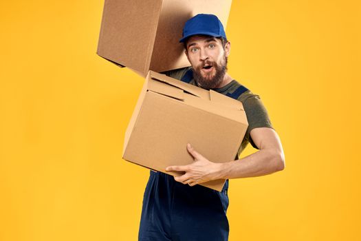 working man with box in hands delivery loading transportation service. High quality photo