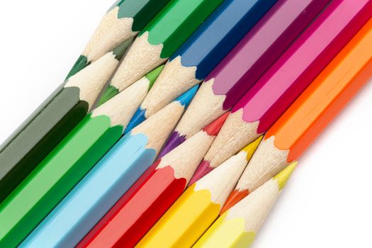 Lot of colorful wooden pencils on a white background