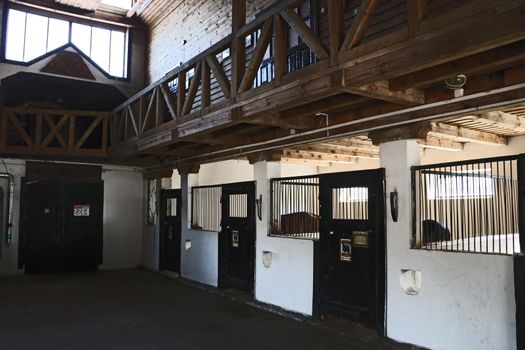 View of the stable in the evening. Pet house