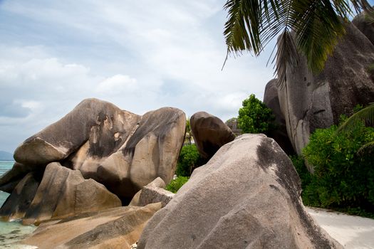 Blue sky with some clouds and big stones in front