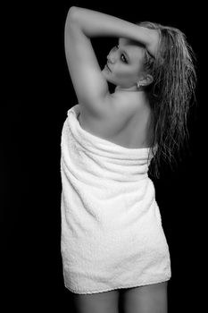 Young woman with a white towel