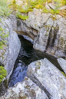 Flowing river water of the waterfall Rjukandefossen in Hemsedal, Viken, Norway.
