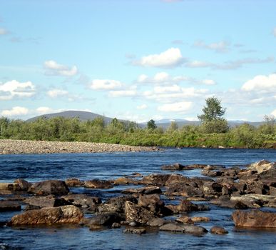 River in the taiga in northern Russia. The nature of the taiga in a mountainous area.