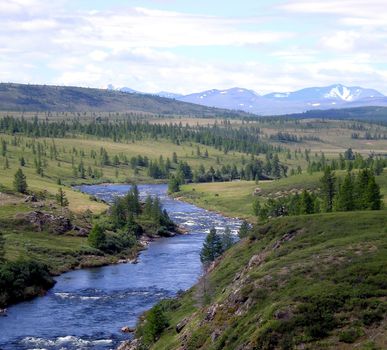River in the taiga in northern Russia. The nature of the taiga in a mountainous area.