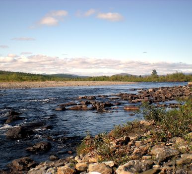 River in the taiga in northern Russia. The nature of the taiga in a mountainous area.