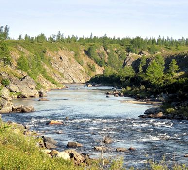 River in the taiga in northern Russia. The nature of the taiga in a mountainous area.