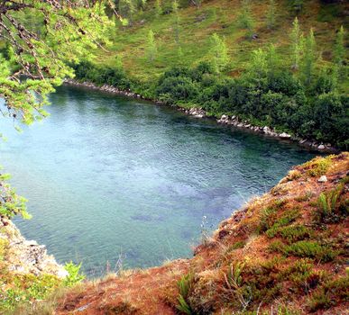 River in the taiga in northern Russia. The nature of the taiga in a mountainous area.
