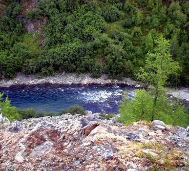 River in the taiga in northern Russia. The nature of the taiga in a mountainous area.