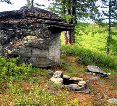 Rocks in the taiga in the Russian north. Exit to the surface of granites and basalts.