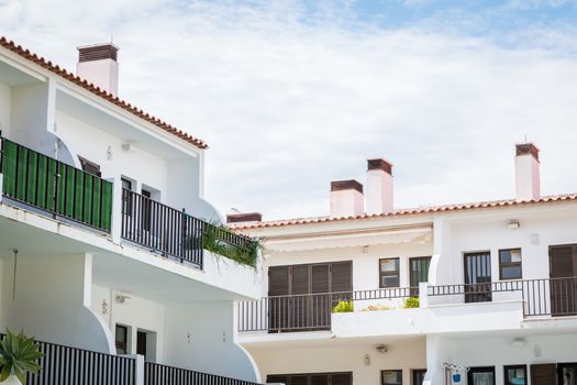 Vilamoura, Portugal - May 2, 2018: Tourist rental building with typical Algarve swimming pool on a spring day