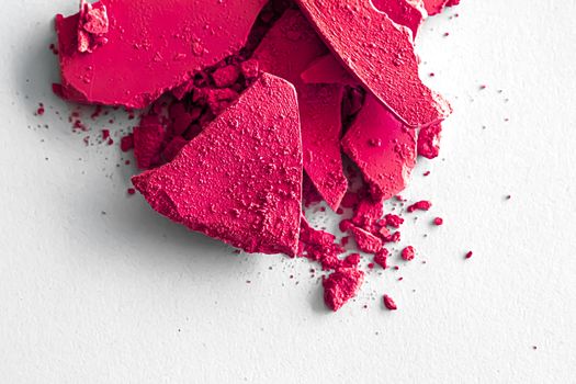 Pink eye shadow powder as makeup palette closeup isolated on white background, crushed cosmetics and beauty textures