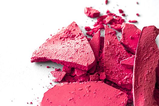 Pink eye shadow powder as makeup palette closeup isolated on white background, crushed cosmetics and beauty textures