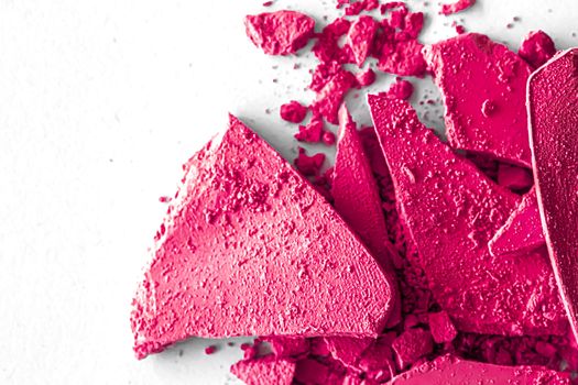 Pink eye shadow powder as makeup palette closeup isolated on white background, crushed cosmetics and beauty textures