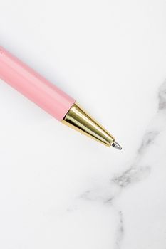 Pink pen on marble background, luxury stationery and business branding