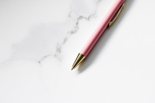 Pink pen on marble background, luxury stationery and business branding