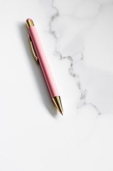 Pink pen on marble background, luxury stationery and business branding