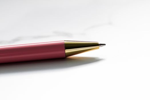 Pink pen on marble background, luxury stationery and business branding