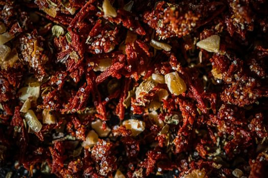 Dried tomato and chili pepper closeup on luxury stone background as flat lay, dry food spices and recipe ingredients