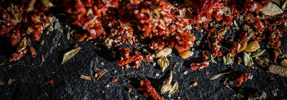 Dried tomato and chili pepper closeup on luxury stone background as flat lay, dry food spices and recipe ingredients