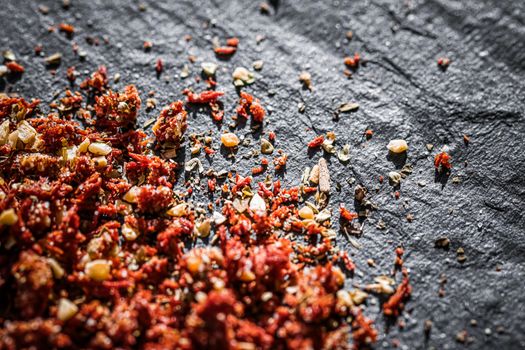 Dried tomato and chili pepper closeup on luxury stone background as flat lay, dry food spices and recipe ingredients