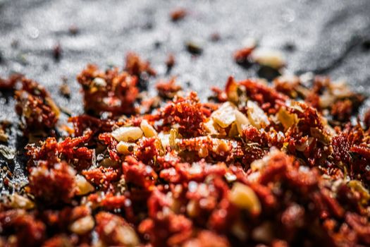 Dried tomato and chili pepper closeup on luxury stone background as flat lay, dry food spices and recipe ingredients