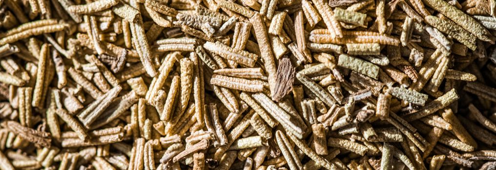 Rosemary closeup on luxury stone background as flat lay, dry food spices and recipe ingredients