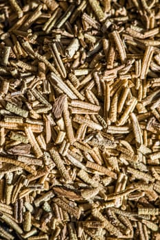 Rosemary closeup on luxury stone background as flat lay, dry food spices and recipe ingredients