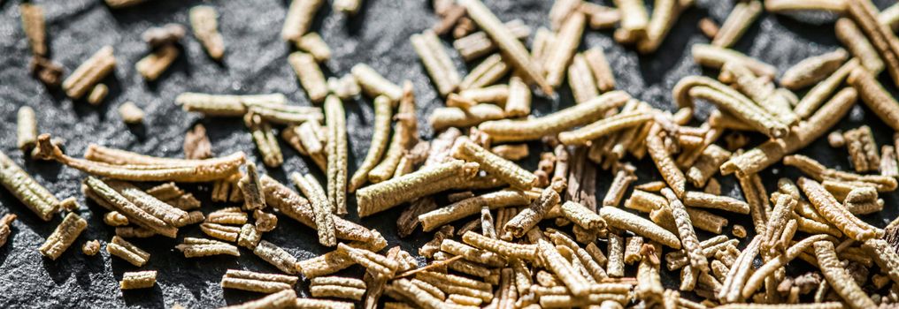 Rosemary closeup on luxury stone background as flat lay, dry food spices and recipe ingredients