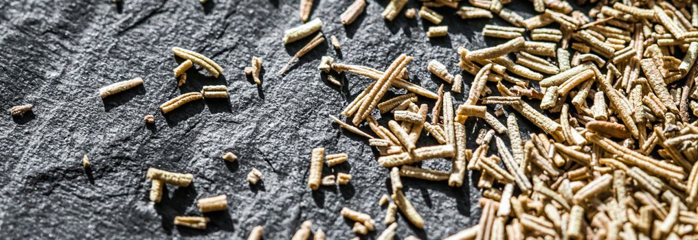 Rosemary closeup on luxury stone background as flat lay, dry food spices and recipe ingredients