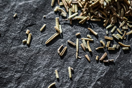 Rosemary closeup on luxury stone background as flat lay, dry food spices and recipe ingredients