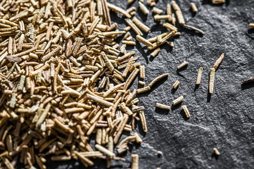 Rosemary closeup on luxury stone background as flat lay, dry food spices and recipe ingredients