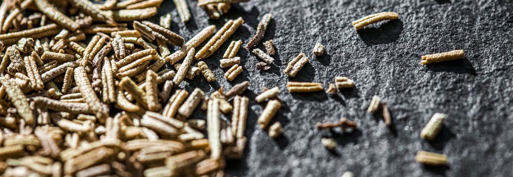 Rosemary closeup on luxury stone background as flat lay, dry food spices and recipe ingredients