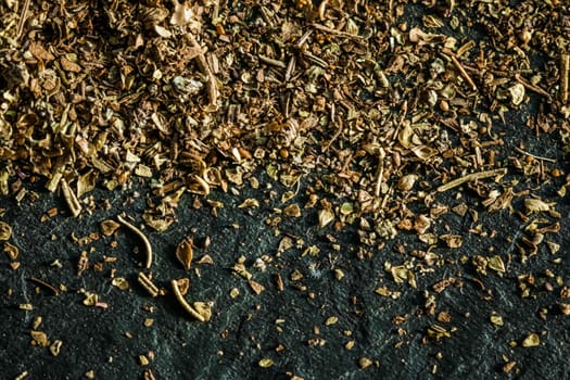 Provencal spices mix closeup on luxury stone background as flat lay, dry food spices and recipe ingredients