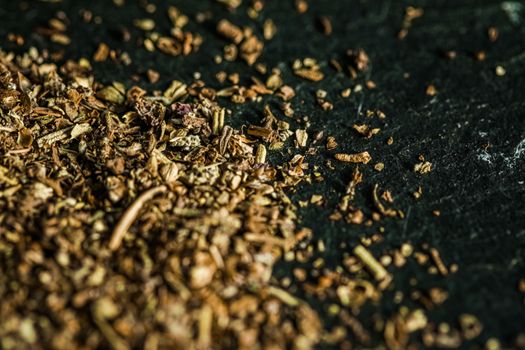 Provencal spices mix closeup on luxury stone background as flat lay, dry food spices and recipe ingredients