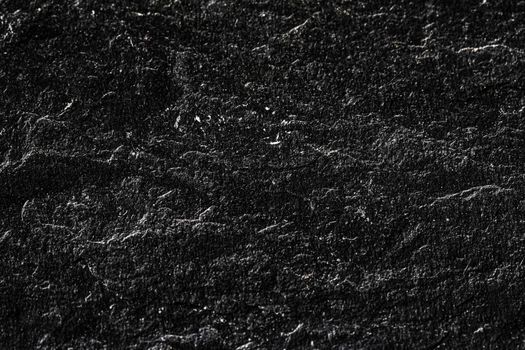 Black stone texture as abstract background, design material and textured surfaces