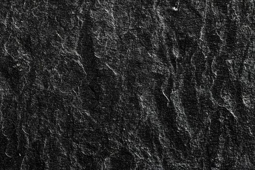 Black stone texture as abstract background, design material and textured surfaces