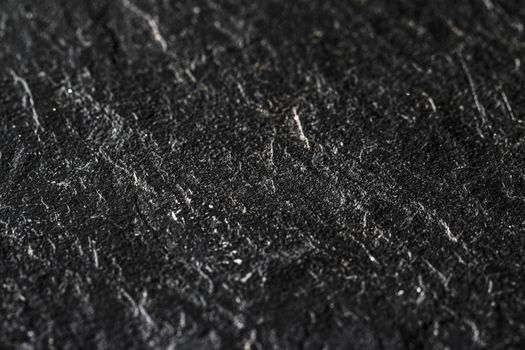 Black stone texture as abstract background, design material and textured surfaces