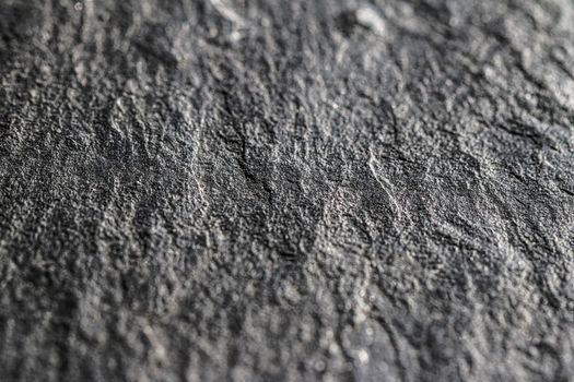 Gray stone texture as abstract background, design material and textured surfaces