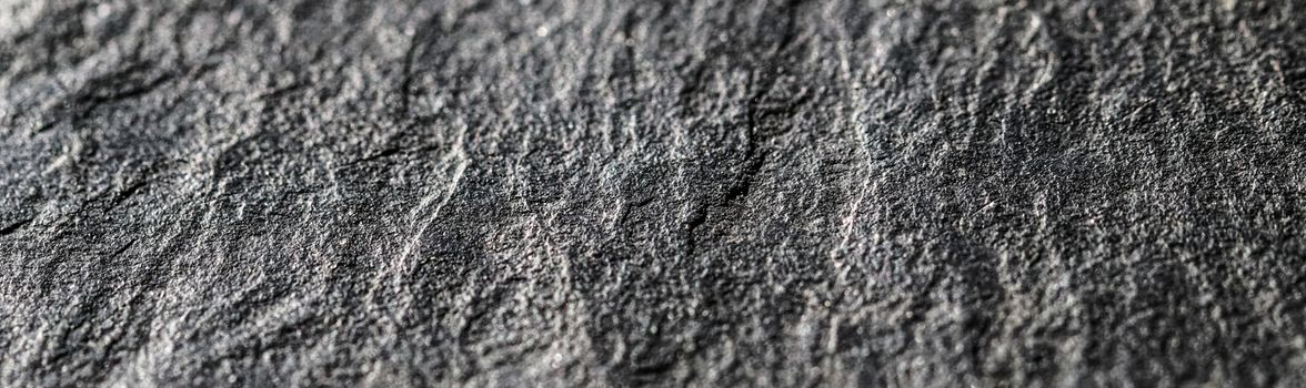 Gray stone texture as abstract background, design material and textured surfaces