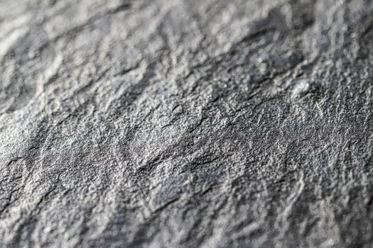 Gray stone texture as abstract background, design material and textured surfaces