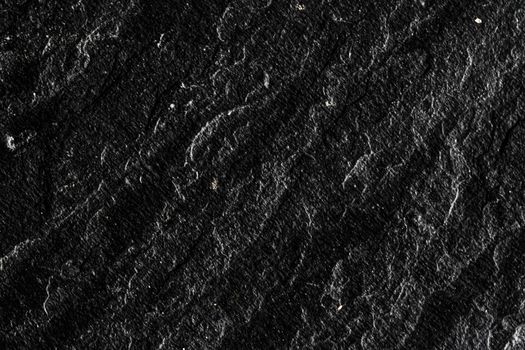 Black stone texture as abstract background, design material and textured surfaces