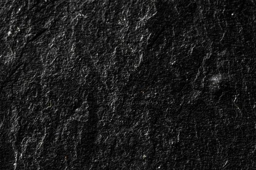 Black stone texture as abstract background, design material and textured surfaces