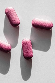 Pink pills as herbal medication, pharma brand store, probiotic drugs as nutrition healthcare or diet supplement products for pharmaceutical industry ads